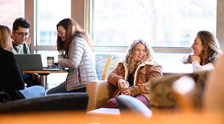 Students sharing coffee at Einstein Bros on campus