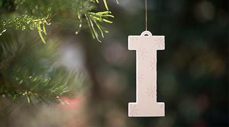 "I" logo on a pine tree for the holidays.