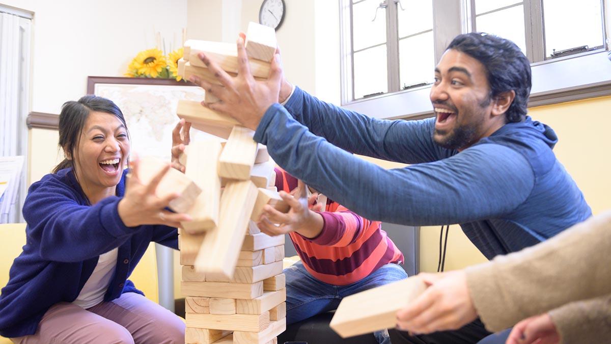 International students play Jenga in the GSSP lounge