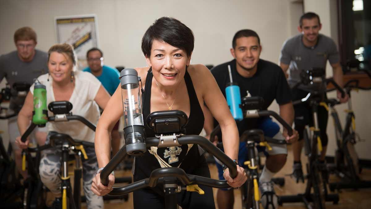 Students attending a spinning class